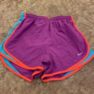 Purple, blue and orange Nike Tempo shorts